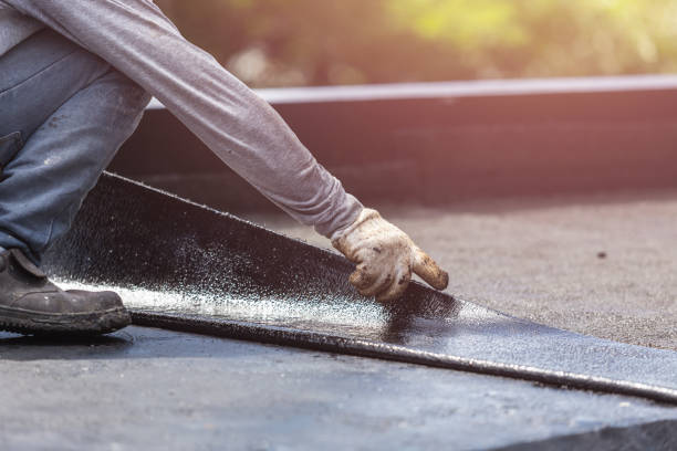 Professional Exterior Waterproofing technician working in Honeoye Falls, NY